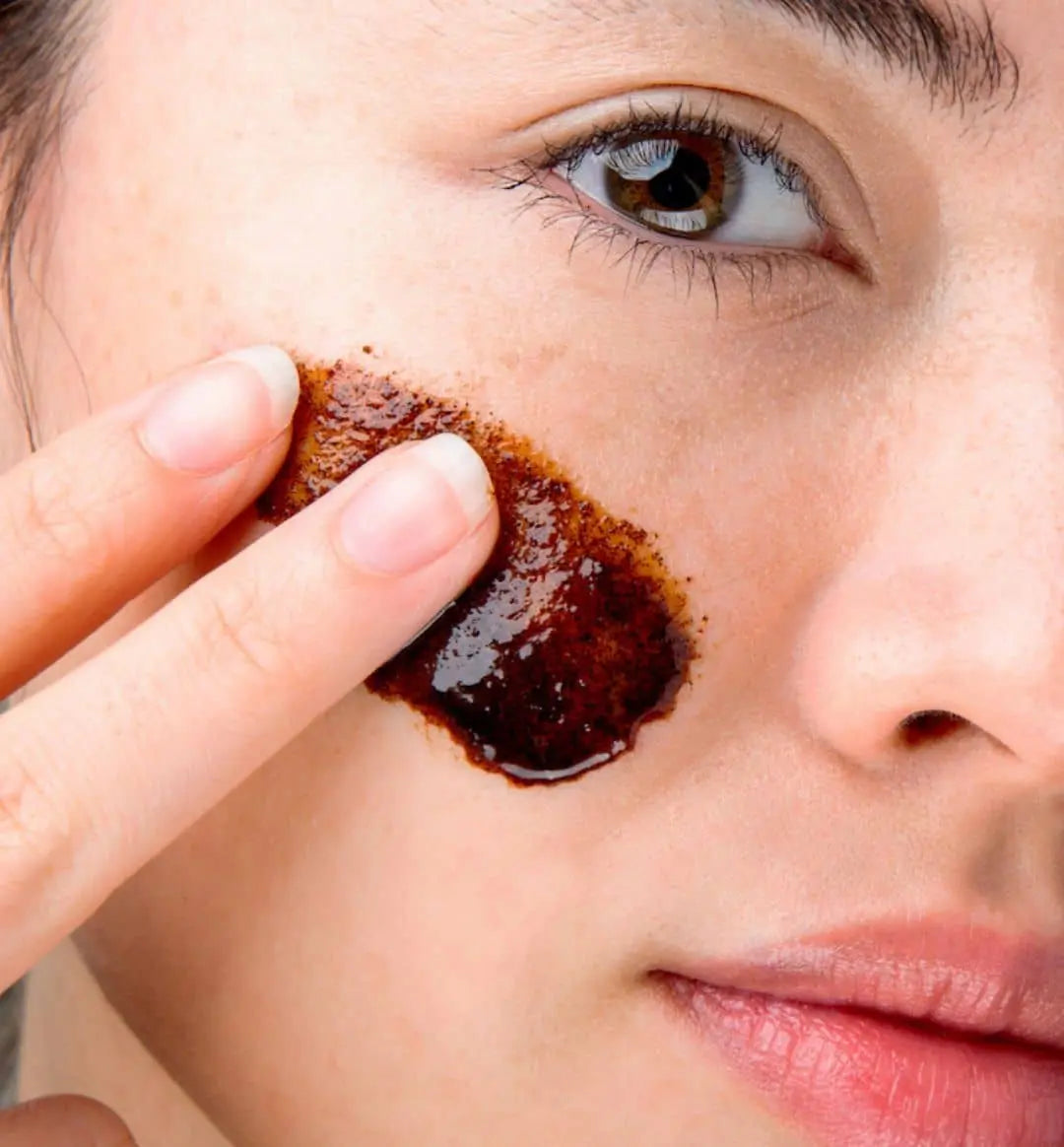 Woman using 100% PURE Acai Facial Scrub