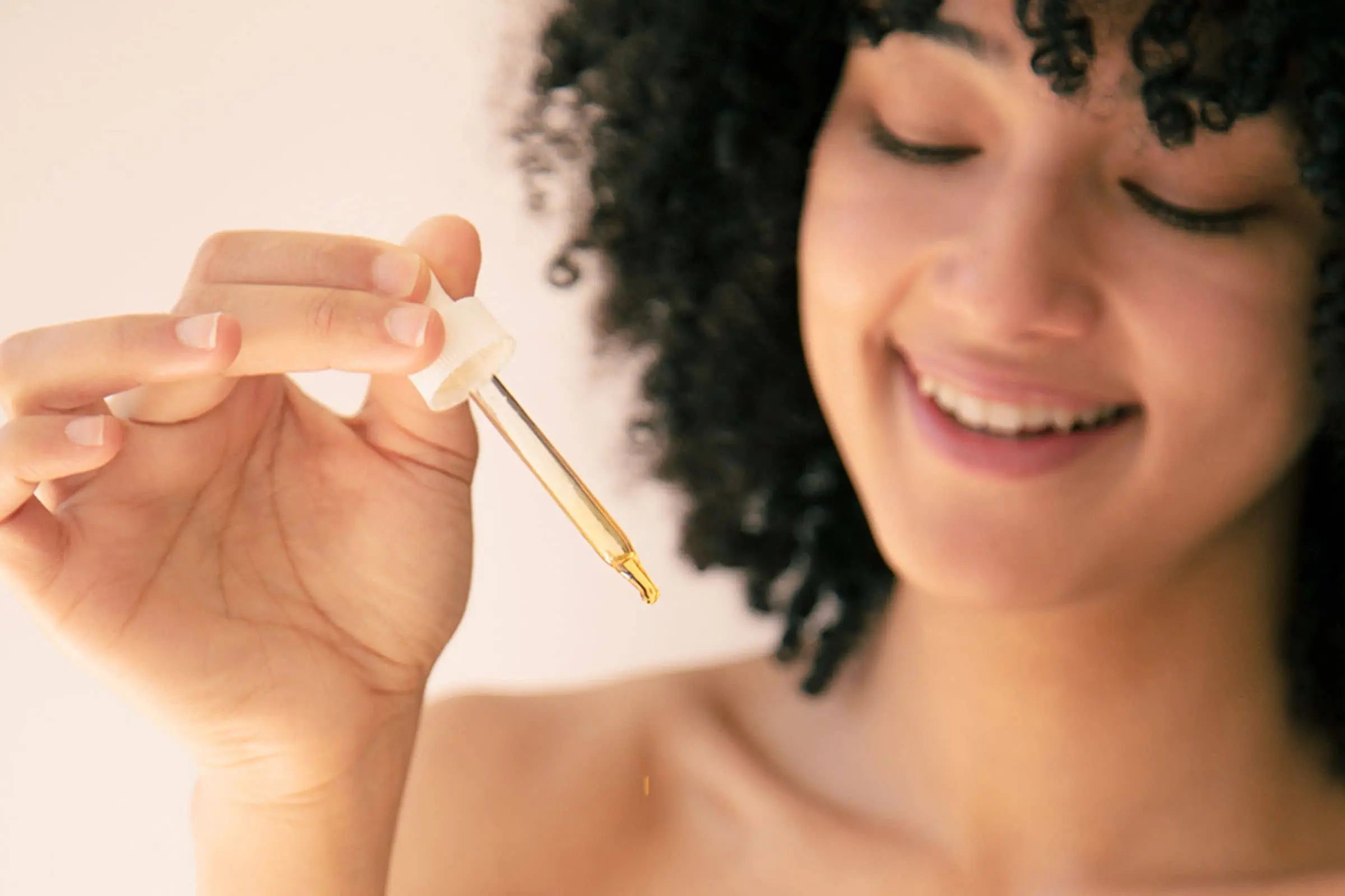 Woman using 100% PURE oil