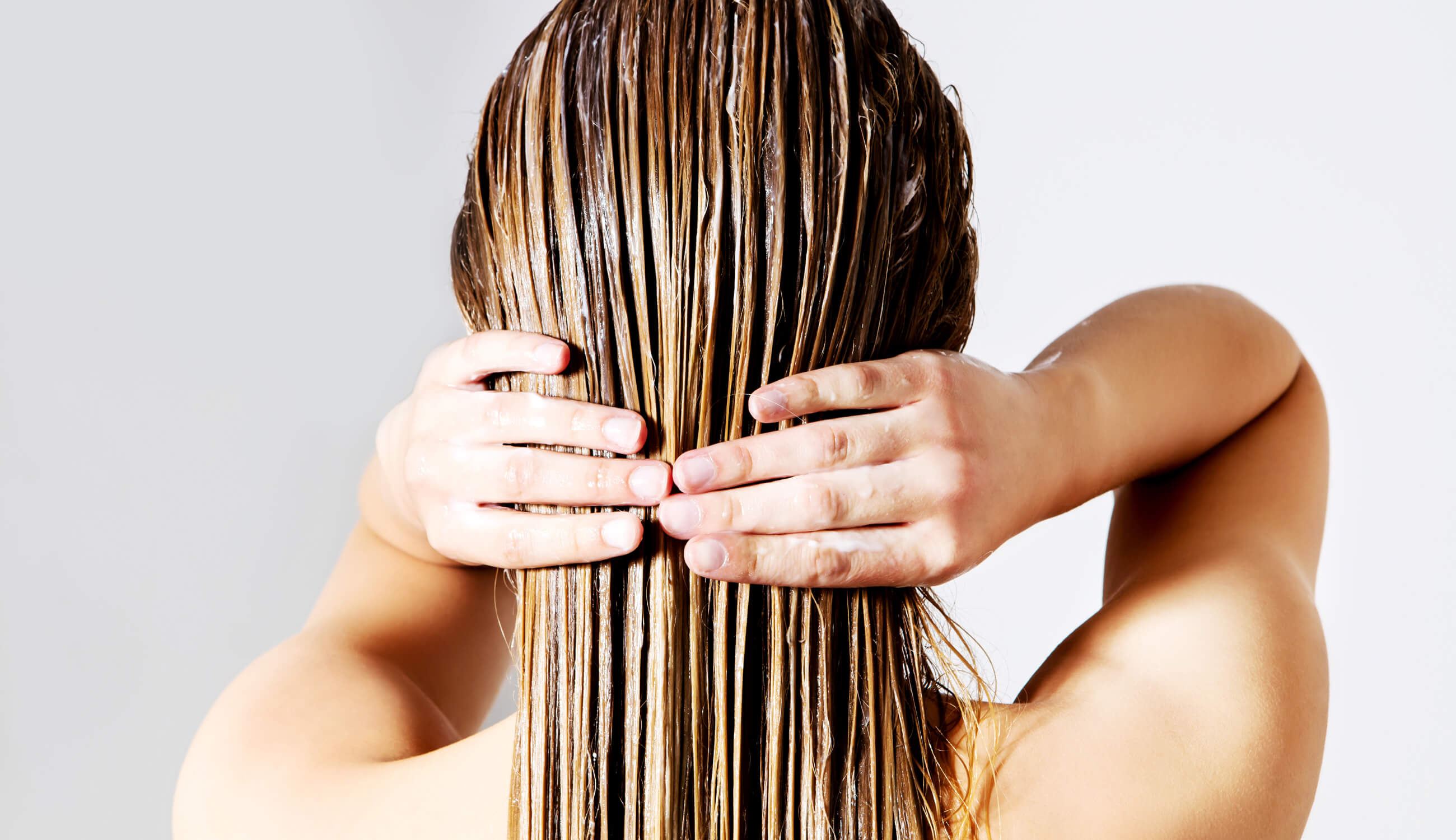 Woman with hair conditioner